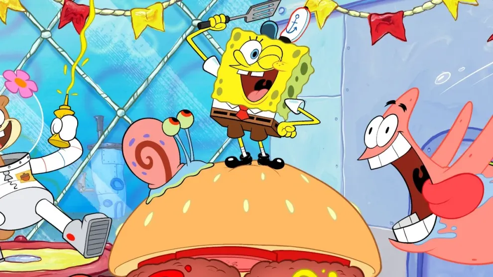 SpongeBob SquarePants and friends celebrate around a giant Krabby Patty shaped like the number 25. Mr. Krabs, Sandy Cheeks, Patrick Star, Squidward, and Gary the snail join the party with confetti and excitement inside the Krusty Krab. The scene is festive with colorful decorations, as SpongeBob stands on top of the burger, smiling.