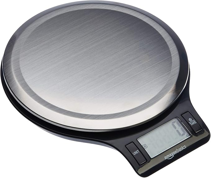 AmazonBasics digital kitchen scale with a sleek stainless steel top and an LCD display, ideal for accurately measuring ingredients for precise cooking. Features easy-to-use unit and tare buttons for added convenience.