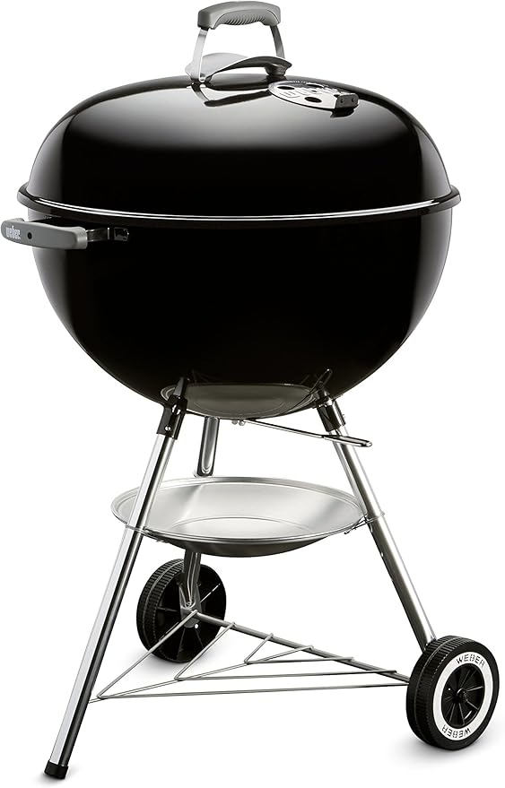 Weber charcoal grill with a classic black dome lid, built-in air vents, and sturdy legs with wheels for portability, perfect for grilling and toasting buns. Features a sleek design and removable ash catcher for easy cleanup.